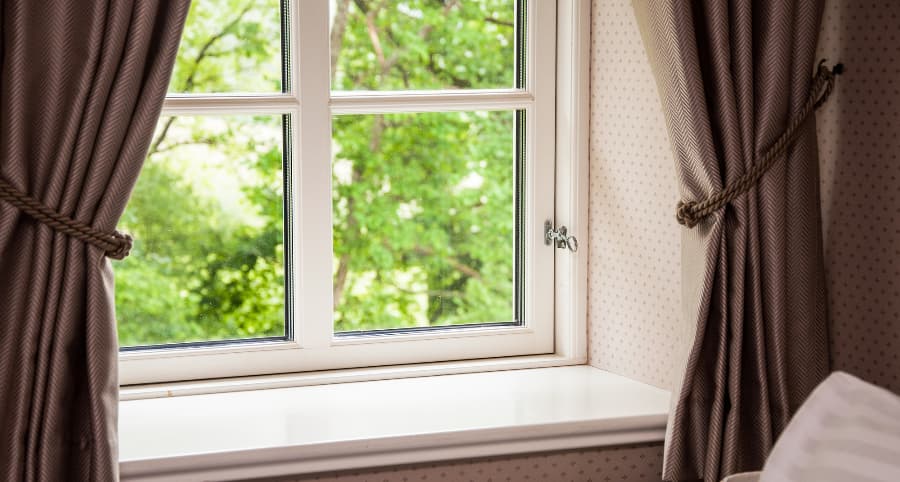 Window inside home with a view to yard